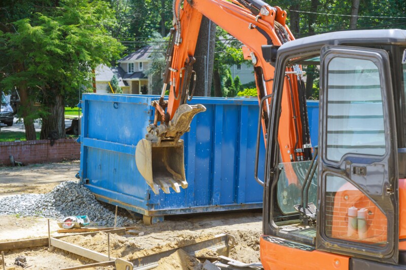 Group of excavator working on a construction site mini excavator and trash container construction dumpsters